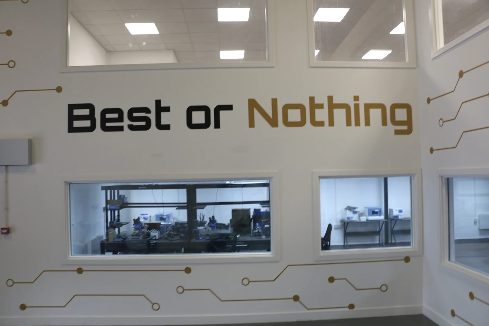 UKTEK facility interior featuring company wall graphics