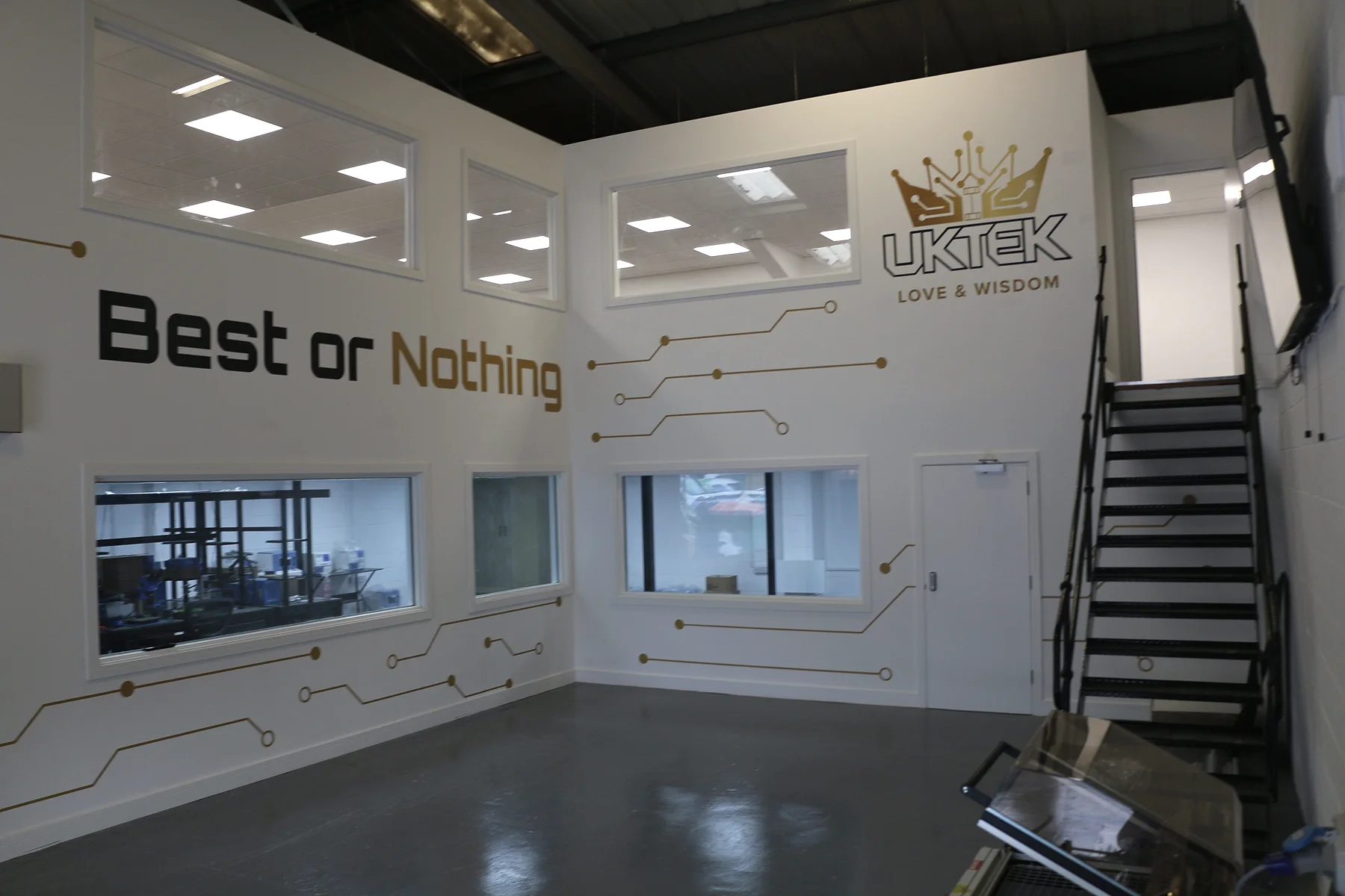 Interior of the UKTEK Maidstone facility with viewing windows and company branding