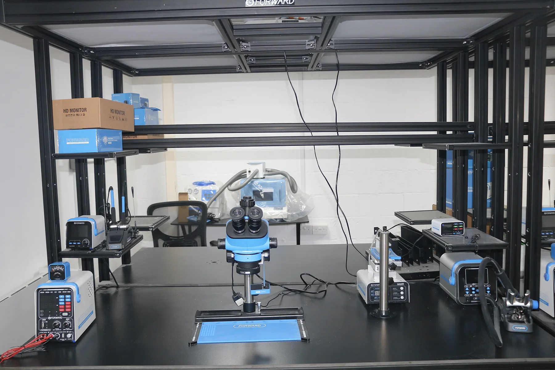 UKTEK technical inspection workbench with microscope and diagnostic equipment